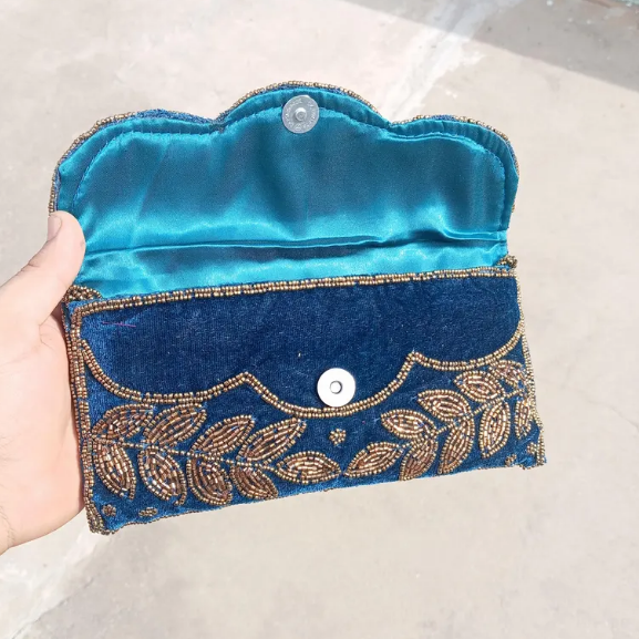 Blue velvet beaded clutch bag
